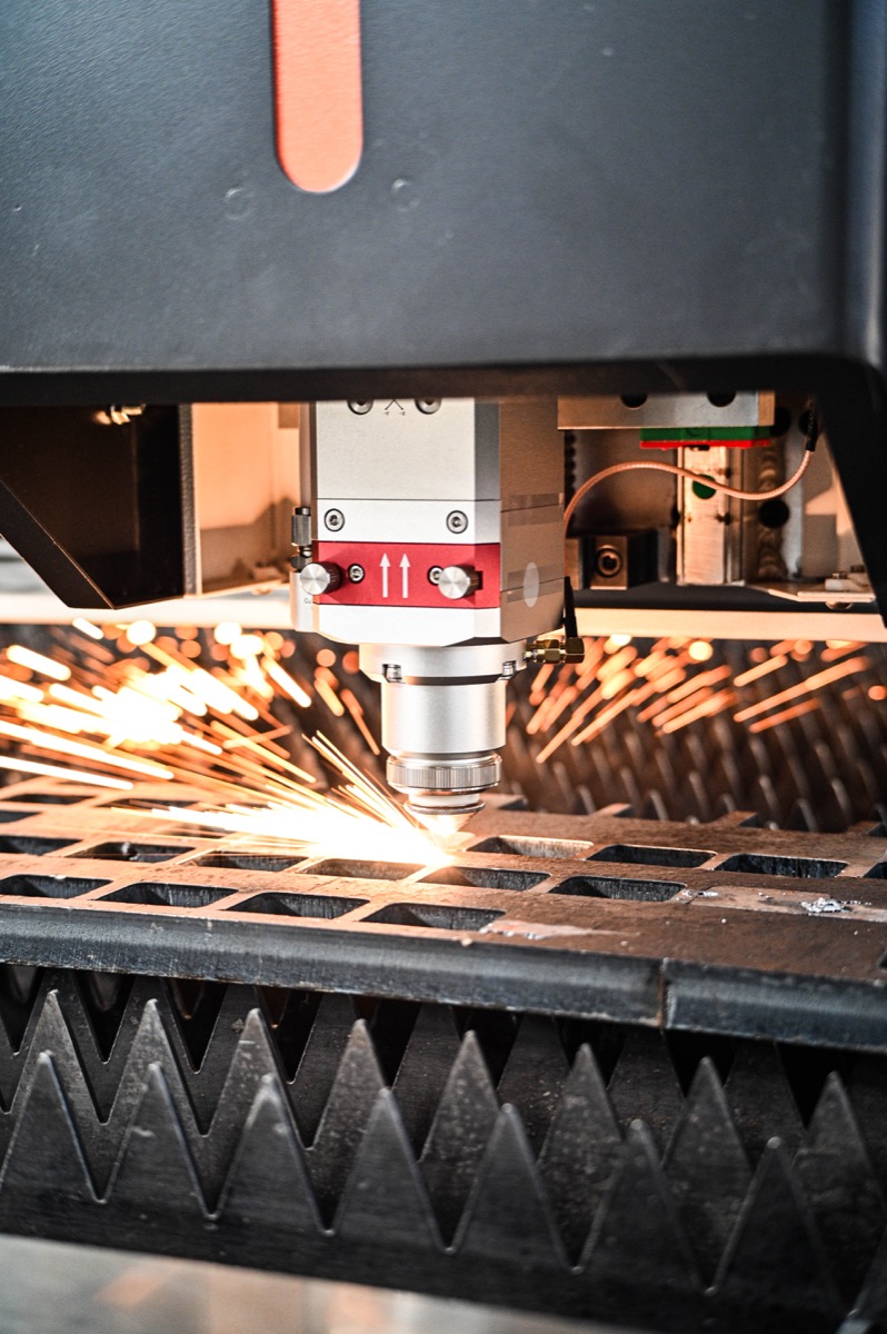 Fibre laser cutting head in operation